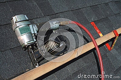 Pneumatic roofing nail gun Stock Photo