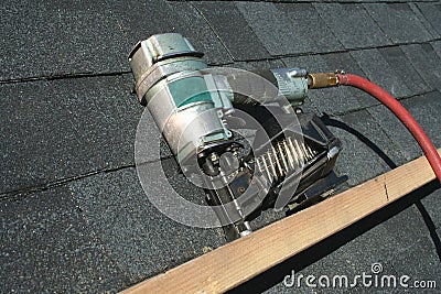 Pneumatic roofing nail gun Stock Photo