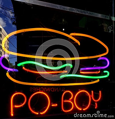 Po-Boy neon sign in a New Orleans French Quarter restaurant window Stock Photo