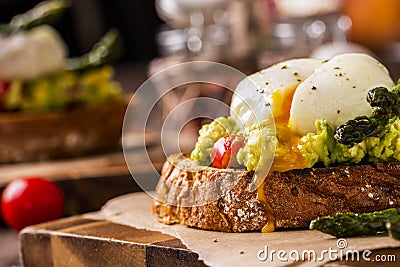 Poached eggs with avocado and asparagus Stock Photo