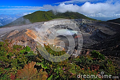 Poas volcano in Costa Rica. Volcano landscape from Costa Rica. Active volcano with blue sky with clouds. Hot lake in the crater Po Stock Photo