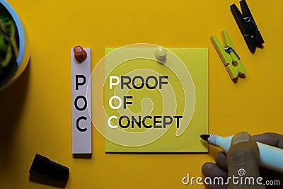 POC. Proof Of Concept acronym on sticky notes. Office desk background Stock Photo