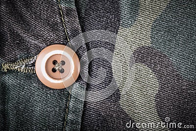 Pocket with a button on the fabric with a camouflage pattern. Ba Stock Photo