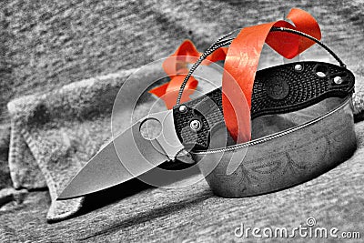 Pocket folding knife black and white vintage vase red tape Stock Photo