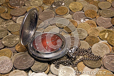 Pocket watch against Russian coins Stock Photo