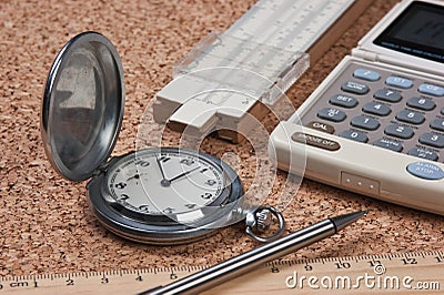 pocket watch, calculator and slide rule Stock Photo