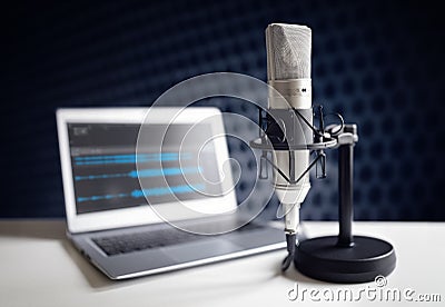 Podcast microphone and laptop computer in recording studio Stock Photo
