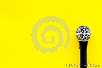 Podcast record with microphone on yellow background top view space for text Stock Photo