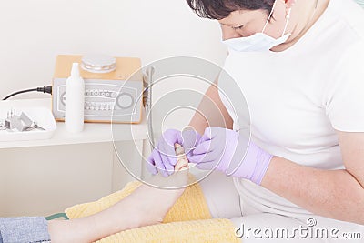 Podiatrist at work Stock Photo