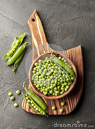 Pods green peas on wooden backgrounds Stock Photo