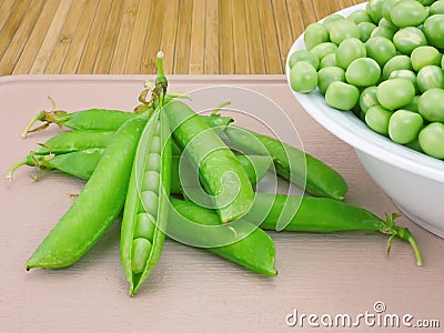 Pods sweet green peas and fresh beans Stock Photo