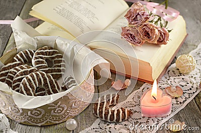 Poem book with burning candle Stock Photo