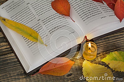 Poetry open book with candle Stock Photo