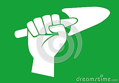 Gardening concept with a raised fist holding a dibble. Stock Photo