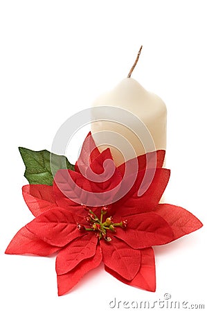 Poinsettia with yellow candle Stock Photo