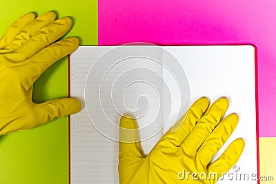 Point gloved finger to a blank magazine page. Bright pink and yellow background. hazard Stock Photo