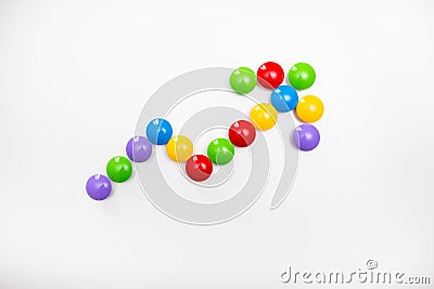 A pointing arrow made from children`s toys. Multicolored figures for games Stock Photo