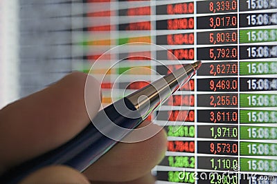 Pointing at stock quotes Stock Photo