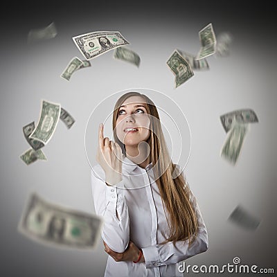 Pointing. Woman in white and dollars. Stock Photo