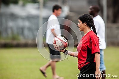 POINTNOIRE/CONGO - 18MAY2013 - Amateur female rugby player to warm up Editorial Stock Photo