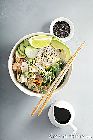 Poke bowl with silken tofu, rice and vegetables Stock Photo