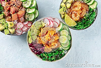Poke bowl variety. Healthy Hawaiian dish with salmon, tuna, and shrimps Stock Photo