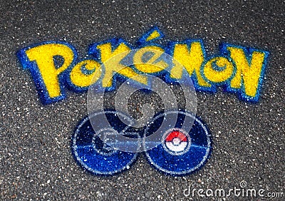 Pokemon GO logo ball drawn on asphalt Editorial Stock Photo