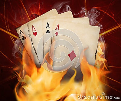 Poker cards burn in the fire Stock Photo