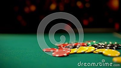 Poker chips lying on green table, poker and blackjack casino games, betting Stock Photo