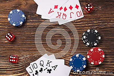 Poker game on a wooden table, cards with chips and dice of poker Stock Photo