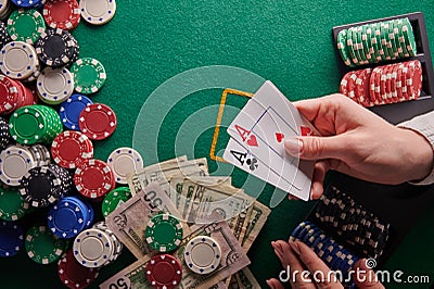 A poker player in a casino is a combination of a pair of aces, a lot of money and chips. horizontal frame. casino background with Stock Photo