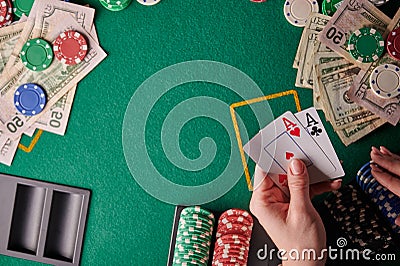 A poker player in a casino is a combination of a pair of aces, a lot of money and chips. horizontal frame. casino background with Stock Photo