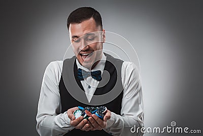Poker player taking poker chips after winning Stock Photo