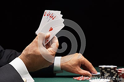 Poker player winning hand of cards royal flush Stock Photo