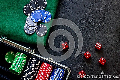 Poker set in a metallic case and green gambling cloth on a grey table top view copyspace Stock Photo