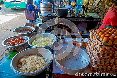POKHARA, NEPAL OCTOBER 10, 2017: Close up of asorted food, noodles, lettuce and eggs inside of metallic trays in a Editorial Stock Photo