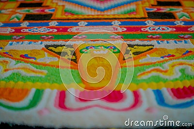 POKHARA, NEPAL - OCTOBER 06 2017: Close up of a detailed and colorful typical handmade carved structure in the ground of Editorial Stock Photo
