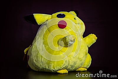 PokÃ©mon center plush doll Pikachu on black background Editorial Stock Photo