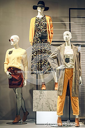 POLAND, BYDGOSZCZ - November 26, 2019: Standing women dummies show casual style collection of clothes in showcase Editorial Stock Photo