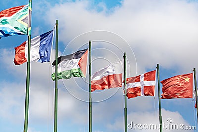 Poland, Denmark, Czech Republic, France, Sudan, South Africa, China flags on sky Stock Photo