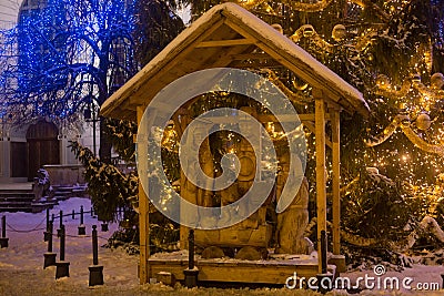 POLAND, GDANSK - DECEMBER 30, 2014: Nativity scene on the Long Market Dlugi Targ street at night near Christmas tree. Editorial Stock Photo
