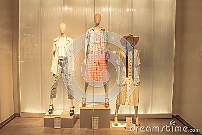 POLAND, TORUN - March 1, 2020: Three female mannequins in store window show spring summer clothing collection Editorial Stock Photo