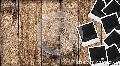 Polaroid photo frames wooden background. Wood table texture Stock Photo