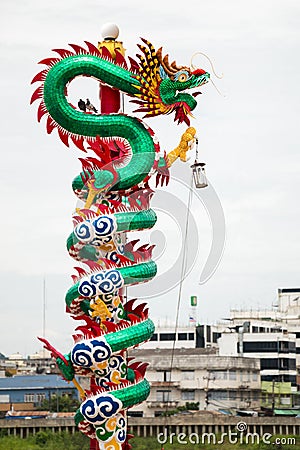 A pole wrapped around by Chinese Dragon Editorial Stock Photo