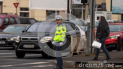 Police agent, Romanian Traffic Police (Politia Rutiera) directing traffic Editorial Stock Photo