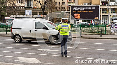 Police agent, Romanian Traffic Police (Politia Rutiera) directing traffic Editorial Stock Photo