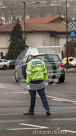 Police agent, Romanian Traffic Police (Politia Rutiera) directing traffic Editorial Stock Photo