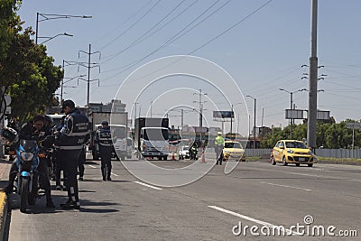 Police agents and traffic agents on checkpoint near to Transmilenio 