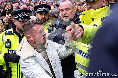 Police arrest far right agitator Tommy Robinson at the March Against Antisemitism, London, UK Editorial Stock Photo