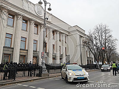 A police car guards public safety near the building of the Verkhovna Rada of Ukraine Editorial Stock Photo